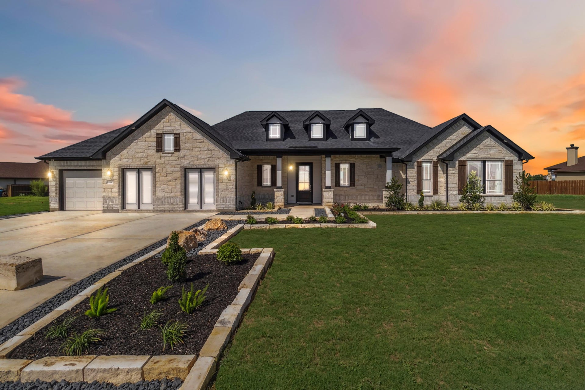 Front view of First America Homes' Bonita Vista model home in San Antonio Tx at twilight